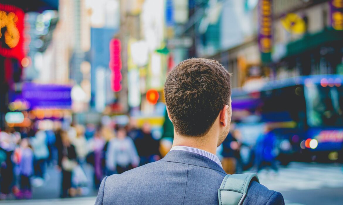 shallow focus photography of man in suit jacket's back