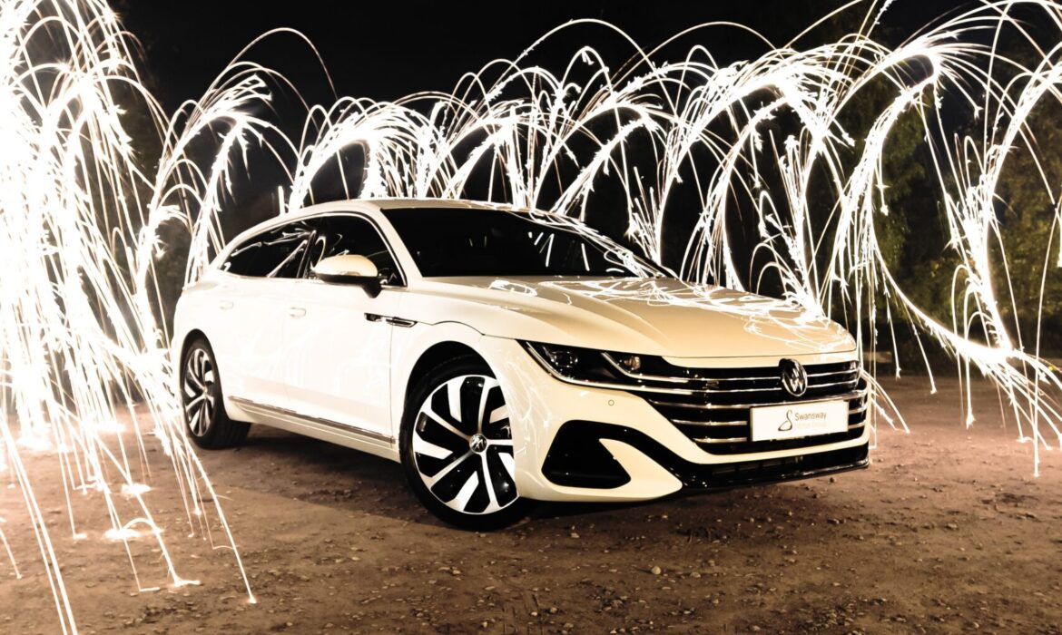 a car parked on a dirt road with sparks coming out of it